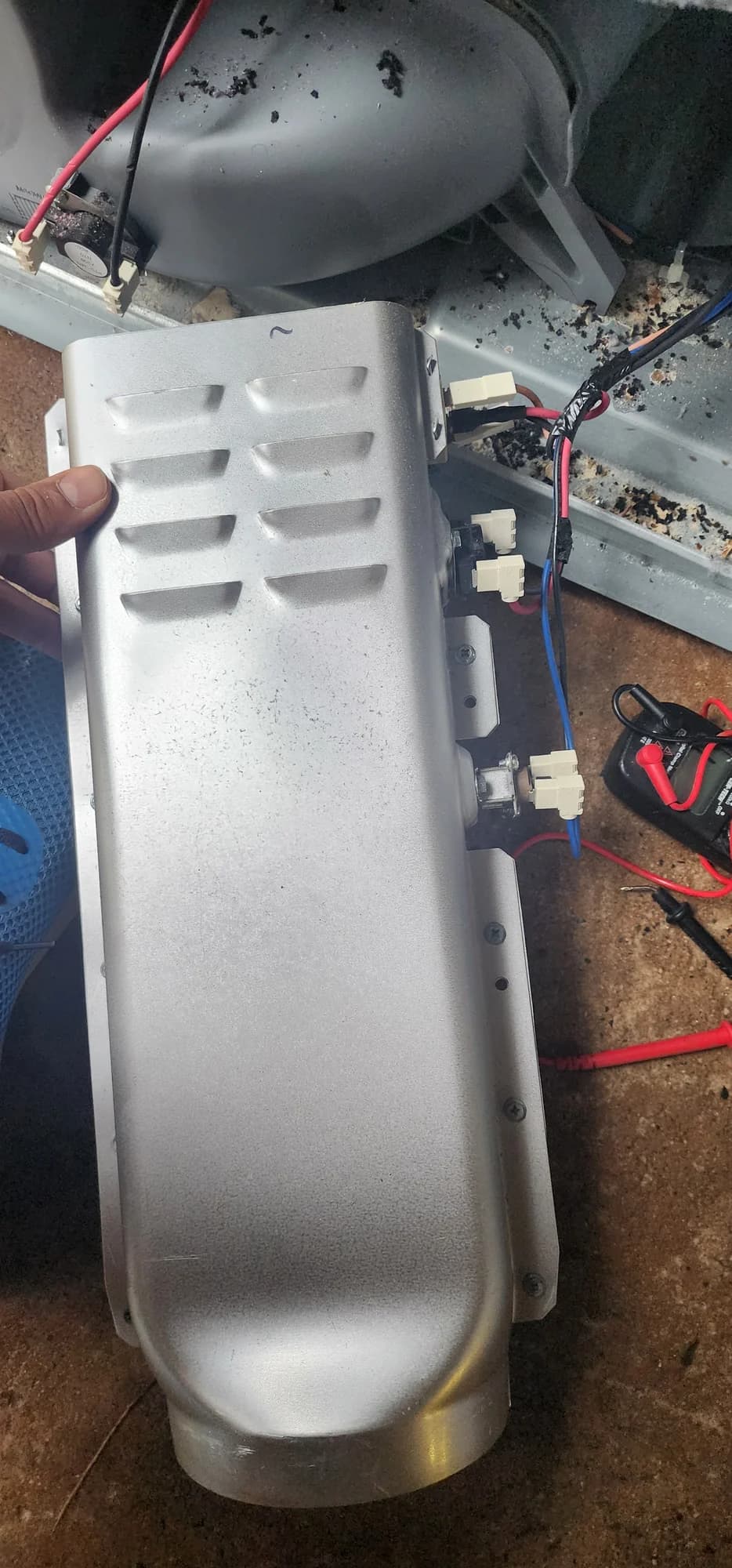 LG dryer heating-element assembly in its metal housing during replacement in Charlotte