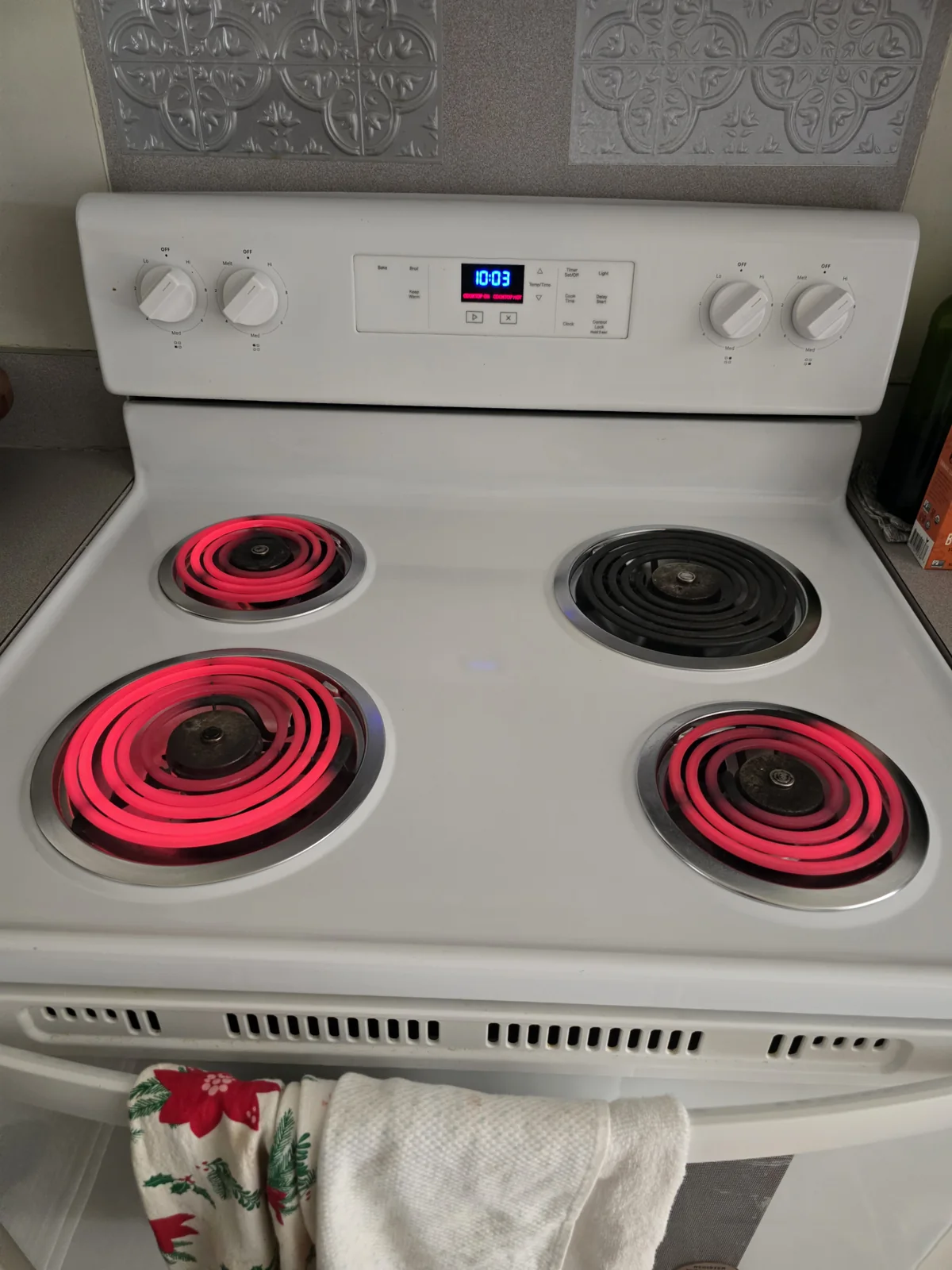 Whirlpool stove with the rear-right coil burner visible at the back right